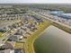 Breathtaking aerial view of lakeside homes in a vibrant community near shopping and recreation at 11476 Sage Canyon Dr, Riverview, FL 33578