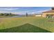 An expansive backyard area with a lake view at 11476 Sage Canyon Dr, Riverview, FL 33578