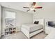 Bright bedroom with a bed, window, and modern furniture at 11476 Sage Canyon Dr, Riverview, FL 33578