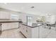 Open kitchen and dining area with stainless steel appliances, granite counters, and island at 11476 Sage Canyon Dr, Riverview, FL 33578