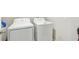 A laundry room area with a washing machine and dryer at 11476 Sage Canyon Dr, Riverview, FL 33578