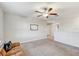 Open living room featuring a ceiling fan and plenty of natural light at 11476 Sage Canyon Dr, Riverview, FL 33578