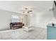Open-concept living and dining room featuring sleek tile flooring, and natural light at 11476 Sage Canyon Dr, Riverview, FL 33578