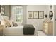 Serene bedroom with soft lighting, unique artwork, and an elegant, relaxing design at 11543 71St E Ave, Palmetto, FL 34221