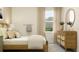 Comfortable bedroom with natural light, a charming dresser, and a relaxing ambiance at 11543 71St E Ave, Palmetto, FL 34221