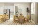 Open concept dining area with a view into the kitchen, stylish chairs, and neutral decor at 11543 71St E Ave, Palmetto, FL 34221