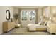 Bright and airy bedroom featuring a comfortable bed, modern decor, and plenty of natural light at 11543 71St E Ave, Palmetto, FL 34221