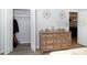 Bedroom features a closet and dresser with decorative accents at 11720 Park Blvd # 301, Seminole, FL 33772