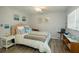 Bedroom featuring a Queen bed with decorative pillows and a desk at 11720 Park Blvd # 301, Seminole, FL 33772