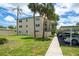 Well-maintained condo building featuring a three-story facade and manicured landscaping for curb appeal at 11720 Park Blvd # 301, Seminole, FL 33772