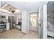 Modern kitchen boasting stainless steel appliances and sleek countertops, next to a bright living space at 11720 Park Blvd # 301, Seminole, FL 33772