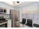 Bright kitchen with stainless appliances, tile backsplash, stylish seating, and a view of the outdoors at 11720 Park Blvd # 301, Seminole, FL 33772