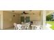 Community patio with several tables and chairs to enjoy the shade with friends and Gathering at 11720 Park Blvd # 301, Seminole, FL 33772