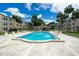 Inviting community pool surrounded by lush landscaping, offering a relaxing oasis for residents at 11720 Park Blvd # 301, Seminole, FL 33772