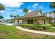 Community pool house and pool surrounded by lush landscaping, offering a relaxing oasis for residents at 11720 Park Blvd # 301, Seminole, FL 33772