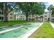 Outdoor shuffleboard courts with shaded picnic area for residents' leisure and recreational activities at 11720 Park Blvd # 301, Seminole, FL 33772