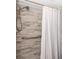 Modern shower with grey tile walls at 11720 Park Blvd # 301, Seminole, FL 33772