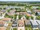 An aerial view shows the home's location near ponds and a community pool at 12107 Fox Bloom Ave, Gibsonton, FL 33534