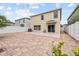 The backyard has a brick paver patio, white fence, and lush landscaping at 12107 Fox Bloom Ave, Gibsonton, FL 33534