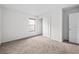 Carpeted bedroom with a window and closet with sliding doors at 12107 Fox Bloom Ave, Gibsonton, FL 33534