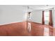 Large bedroom with hardwood floors, ceiling fan, and window at 12107 Fox Bloom Ave, Gibsonton, FL 33534