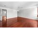 Large bedroom with a ceiling fan and wood floors, featuring a walk-in closet at 12107 Fox Bloom Ave, Gibsonton, FL 33534