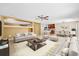 Bright, open living area with neutral decor flowing into the kitchen and dining space at 12107 Fox Bloom Ave, Gibsonton, FL 33534