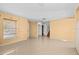 Open-concept living area with tile flooring and staircase at 12107 Fox Bloom Ave, Gibsonton, FL 33534