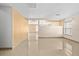 Bright living room with modern tile flooring, neutral walls, and large windows for natural light at 12107 Fox Bloom Ave, Gibsonton, FL 33534