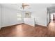 Bright loft with hardwood floors, a ceiling fan, and access to multiple rooms at 12107 Fox Bloom Ave, Gibsonton, FL 33534