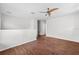 Spacious loft with wood flooring, ceiling fan, and natural light at 12107 Fox Bloom Ave, Gibsonton, FL 33534