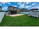Beautiful backyard with green grass, white fence, gazebo, and nice patio at 12499 Longstone Ct, New Port Richey, FL 34655