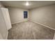 Bedroom featuring neutral walls, plush carpeting, and a window letting in natural light at 12499 Longstone Ct, New Port Richey, FL 34655