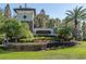 A scenic entrance to Trinity Preserve with lush landscaping and elegant signage at 12499 Longstone Ct, New Port Richey, FL 34655
