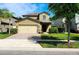 Charming two-story home with a well-manicured lawn and a two car garage at 12499 Longstone Ct, New Port Richey, FL 34655