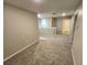 Spacious hallway with neutral walls, plush carpeting, and doorways leading to other rooms at 12499 Longstone Ct, New Port Richey, FL 34655