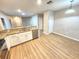 Spacious kitchen boasts modern appliances, granite countertops and wood flooring at 12499 Longstone Ct, New Port Richey, FL 34655