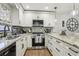 Bright kitchen with stainless steel appliances, granite countertops, and ample cabinet space at 12736 Wood Trail Blvd, Tampa, FL 33625
