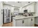 Bright kitchen with stainless steel appliances, granite countertops, and ample cabinet space at 12736 Wood Trail Blvd, Tampa, FL 33625