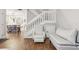 This living room is charming, featuring a staircase and a cozy seating area at 12736 Wood Trail Blvd, Tampa, FL 33625