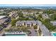 Condominium complex with mature trees and a lake with bridge offering serene water views at 14130 Rosemary Ln # 1202, Largo, FL 33774
