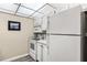 Functional kitchen with white appliances and ample storage solutions at 14130 Rosemary Ln # 1202, Largo, FL 33774