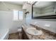 Cozy bathroom featuring a single sink vanity, tile flooring, and a shower/tub at 1622 Elizabeth Ln, Clearwater, FL 33755