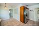 Kitchen with stainless steel refrigerator and tile flooring at 1622 Elizabeth Ln, Clearwater, FL 33755