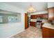 Charming kitchen with stainless steel appliances and tile backsplash provides a functional cooking space at 1622 Elizabeth Ln, Clearwater, FL 33755