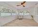Bright bedroom featuring ample natural light, a ceiling fan, and modern decor at 1717 Thames St, Clearwater, FL 33755