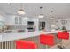Stylish kitchen features white cabinets, stainless steel appliances, and a quartz countertop at 1717 Thames St, Clearwater, FL 33755