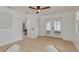 Bright living room featuring french doors to the patio, wood floors, and a neutral color palette at 1717 Thames St, Clearwater, FL 33755