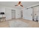 Bright main bedroom with modern sliding door and light wood-look floors for a welcoming retreat at 1717 Thames St, Clearwater, FL 33755