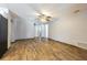 Spacious living area with wood-look floors and ample natural light, offering a flexible layout for furnishings at 1760 Sharondale Dr, Clearwater, FL 33755